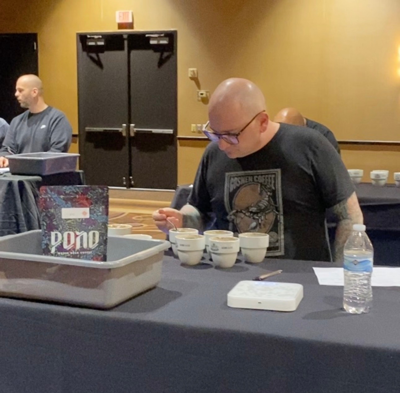 Competitor cupping coffee