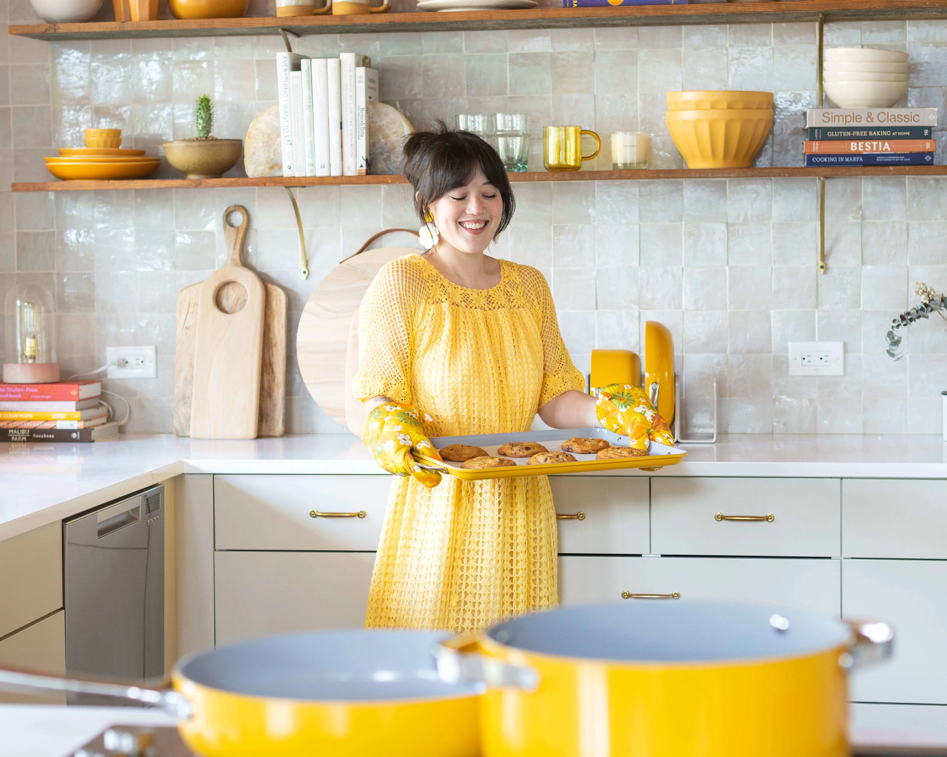 Ceramic Fry Pan and Dutch Oven - Marigold - with Sam Ushiro holding large baking sheet