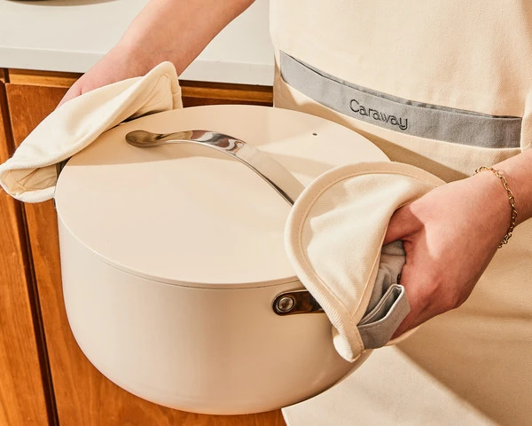 Ceramic Dutch Oven - Cream - held with cream pot holders