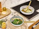 Iconics Glass Lid - Set of 4 - On White Iconics Cookware on Stove