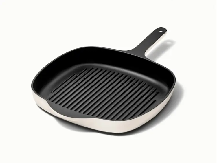 https://images.ctfassets.net/vitsw3itv0qj/78Y5XENTCwDEhLEJ9g3iGH/beb11badc27c982adad71632def048d0/Enameled_Cast_Iron_Grill_Pan_-_Cream_-_Hero.jpg?q=75