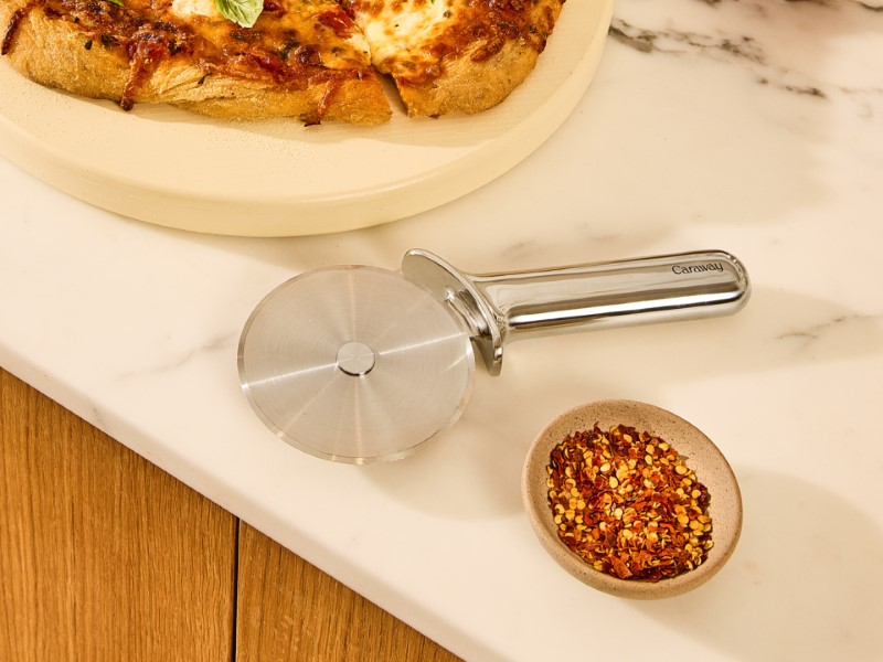 Pizza Cutter - Stainless Steel - Next to Sliced Pizza