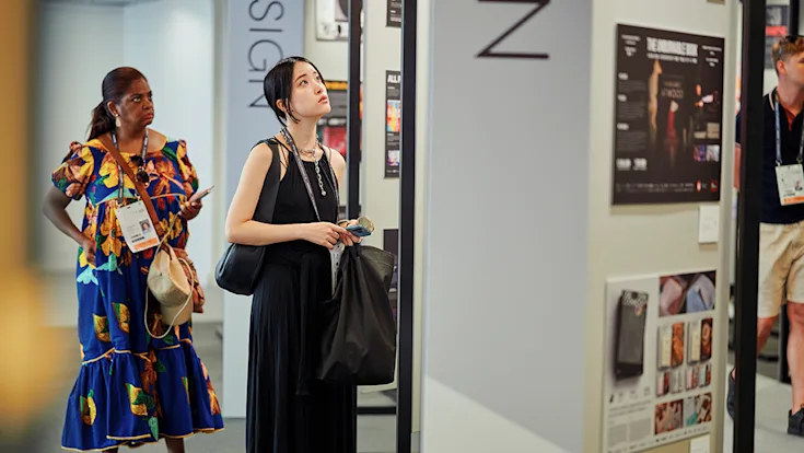 People learning about awarded work at Cannes Lions.