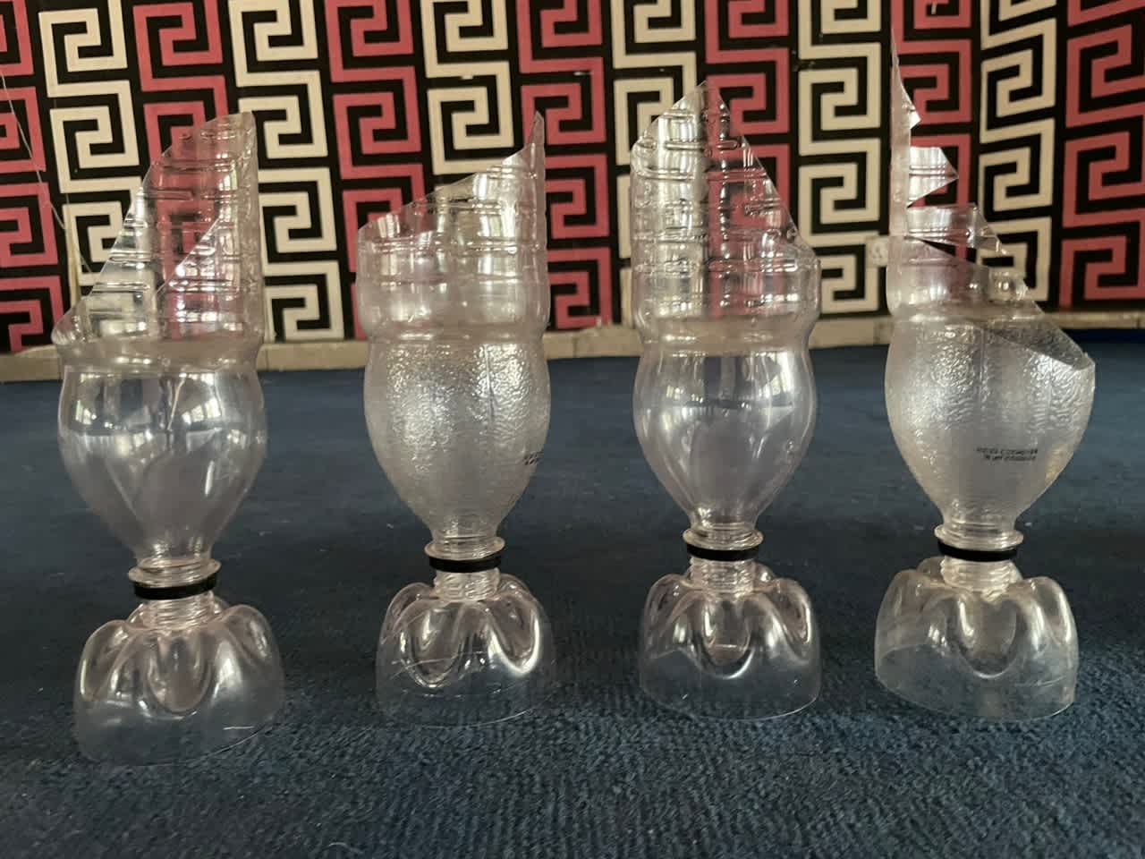 Carving out flower vases from plastic bottles