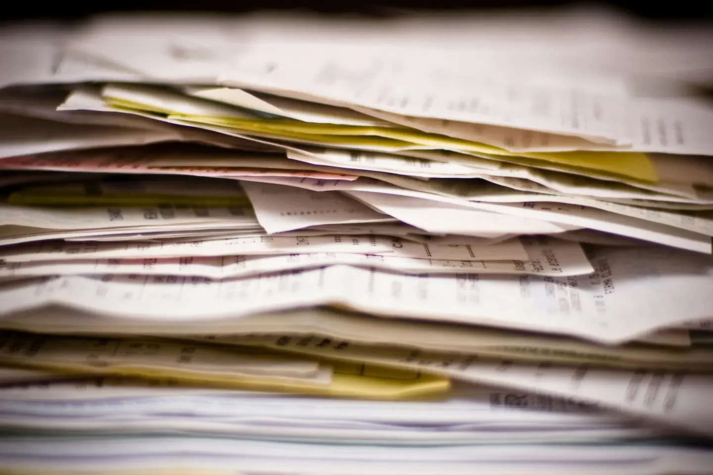 Stack of paperwork and financial records