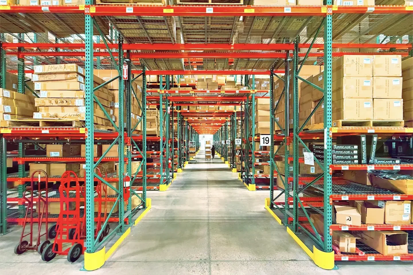 A warehouse is filled with shelves and boxes