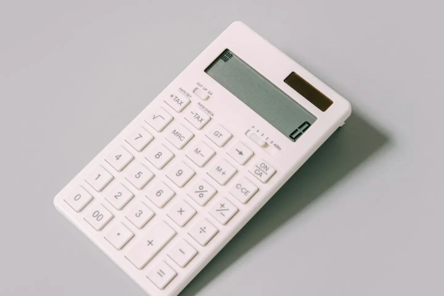 white calculator on white table