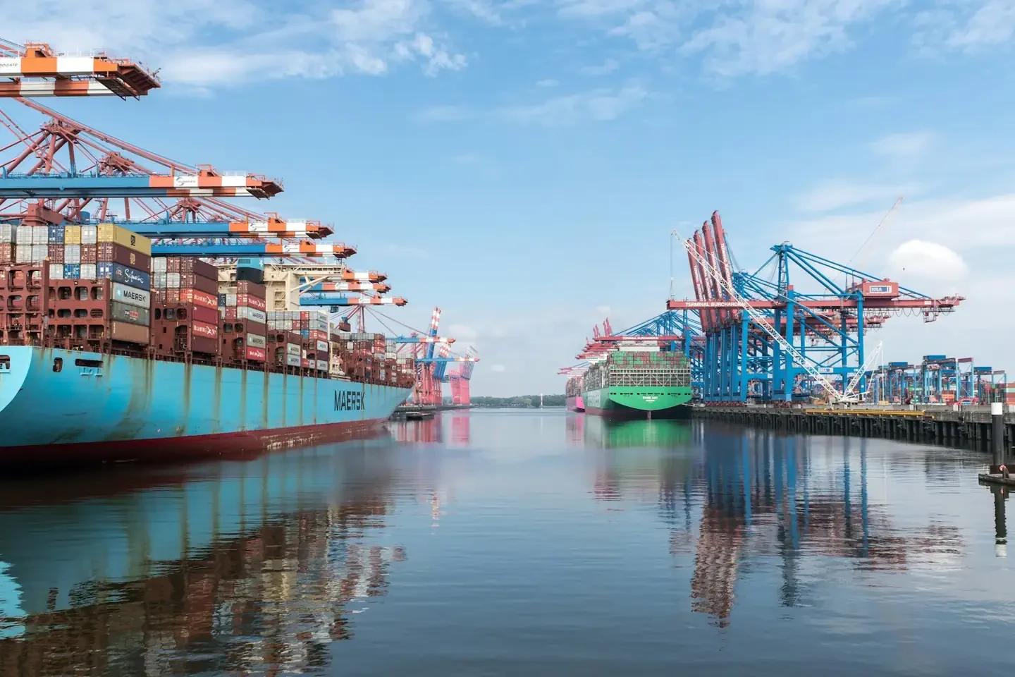 Container ships and cranes at a busy port