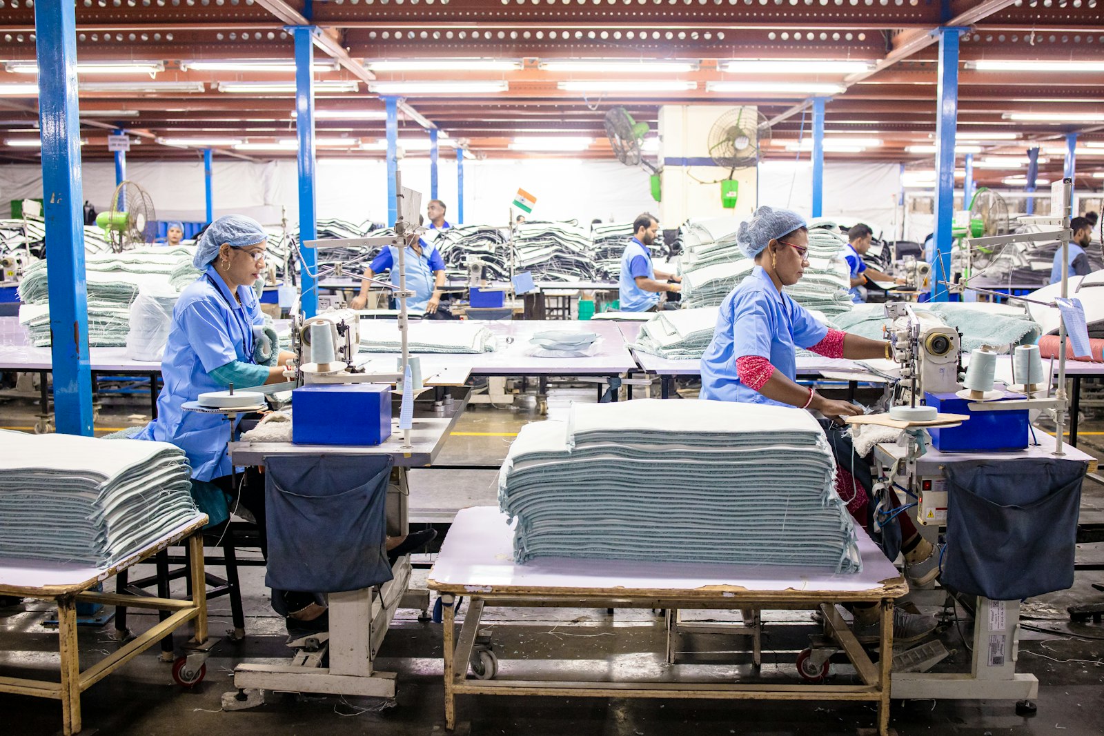 Workers sewing textiles in a garment factory