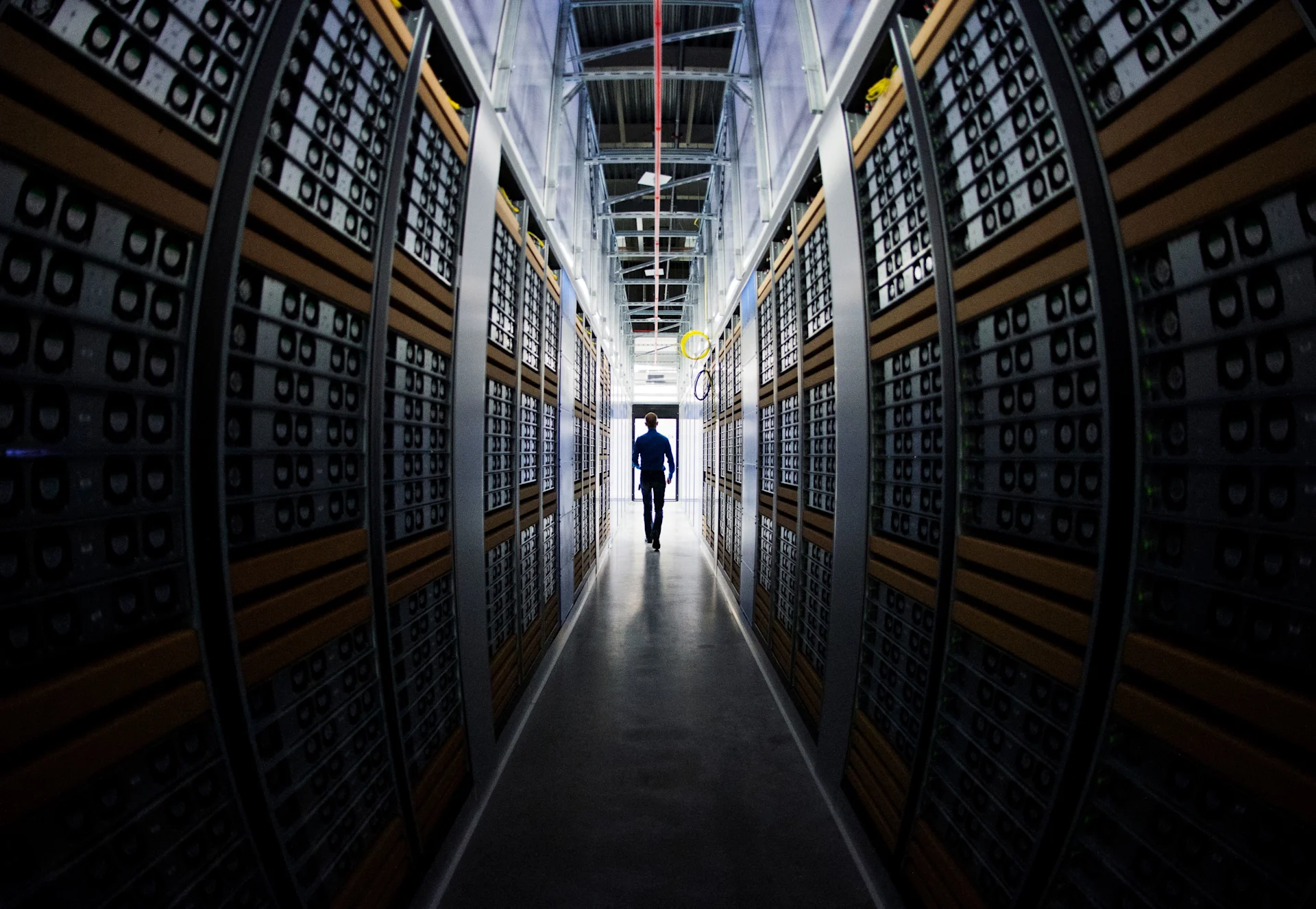 Data Center Manager walks in server rooms