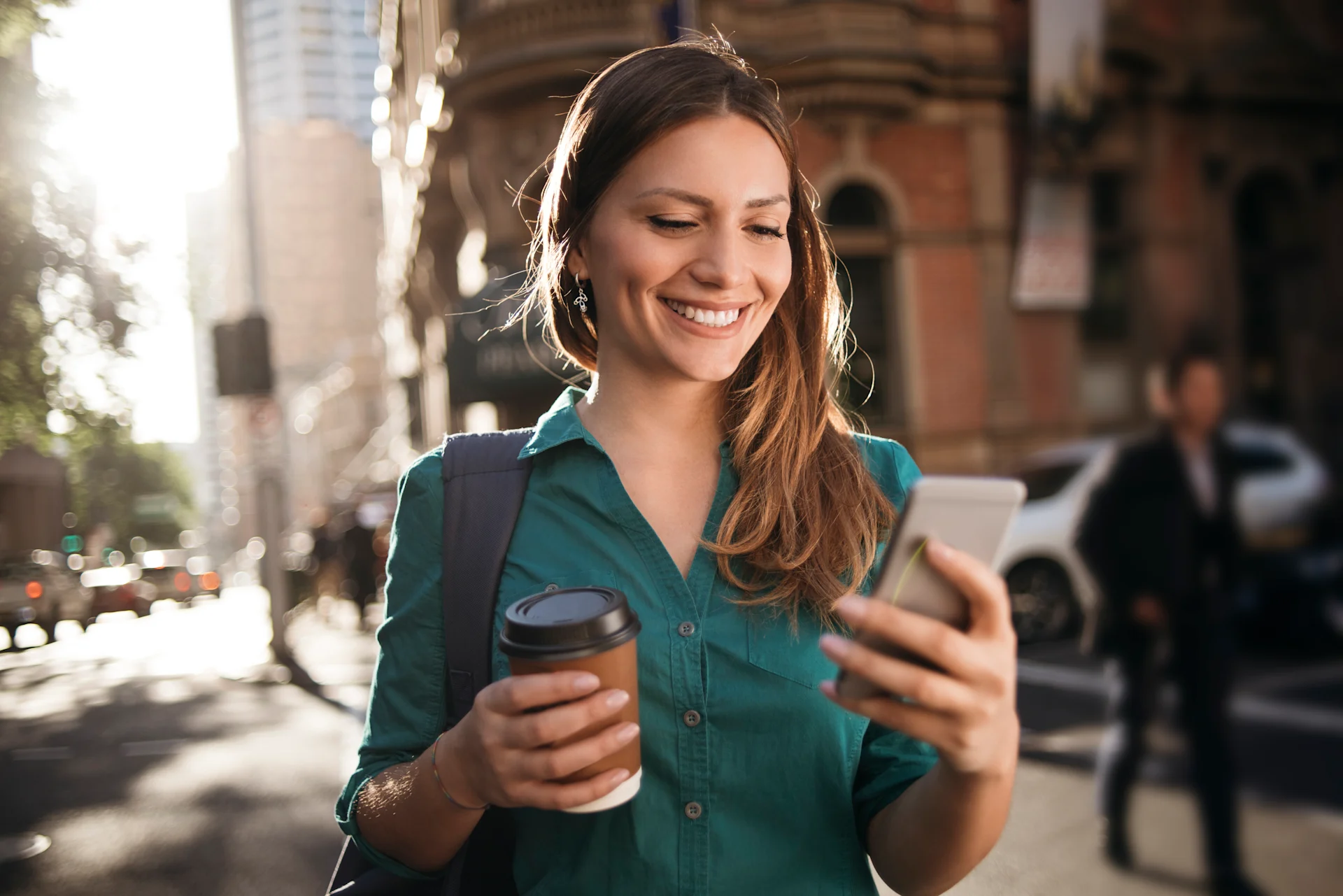 Walking with phone in city Australia