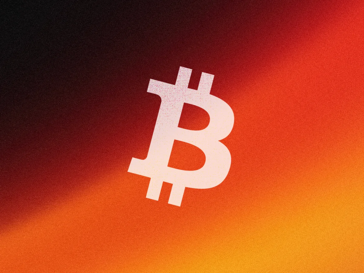 The Bitcoin logo set against a striking red and orange backdrop, representing the dynamic nature of cryptocurrency.