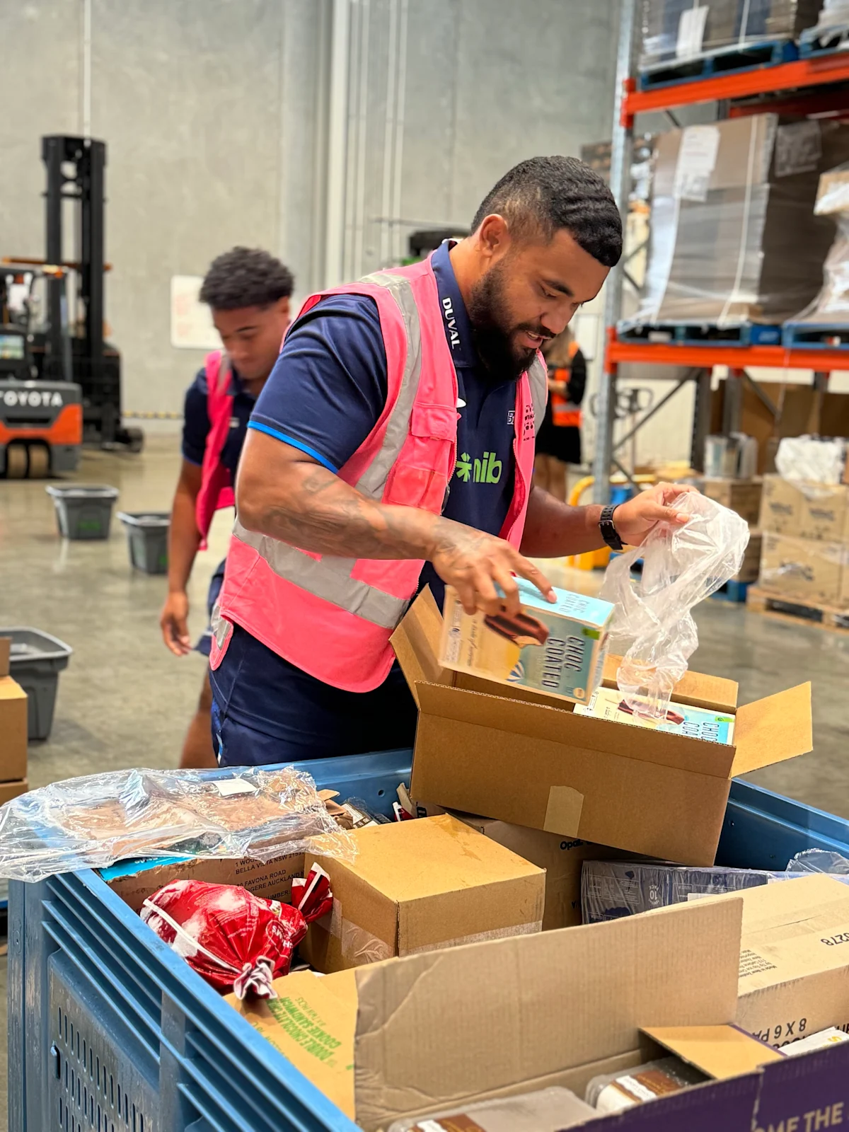 Packing food for KiwiHarvest