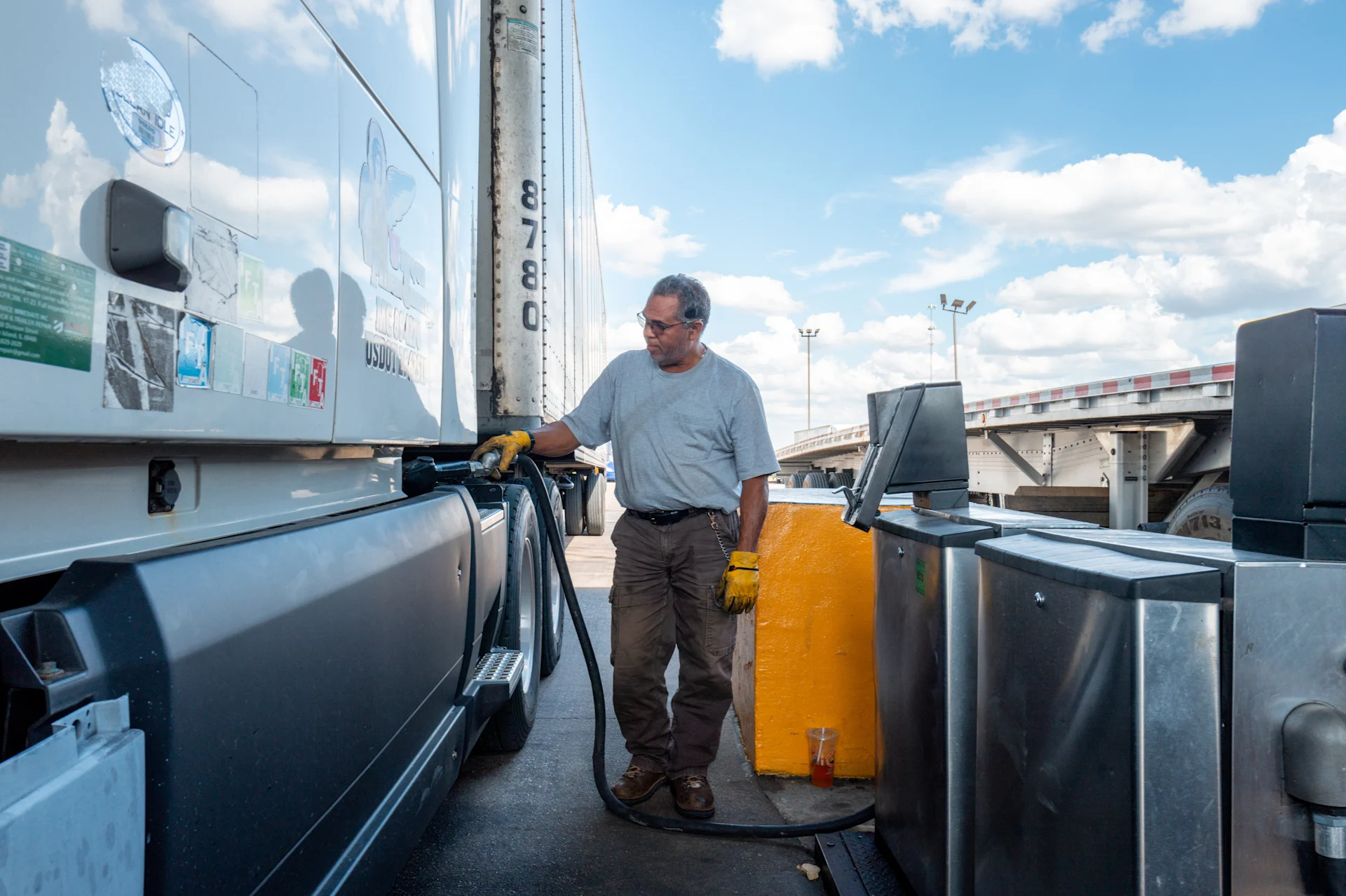 A person pumps diesel at a Pilot gas station in Texas