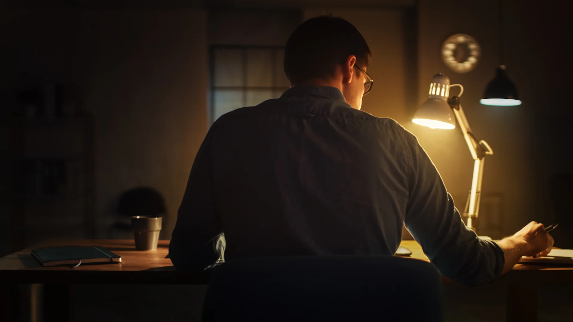 Trader reflecting at desk