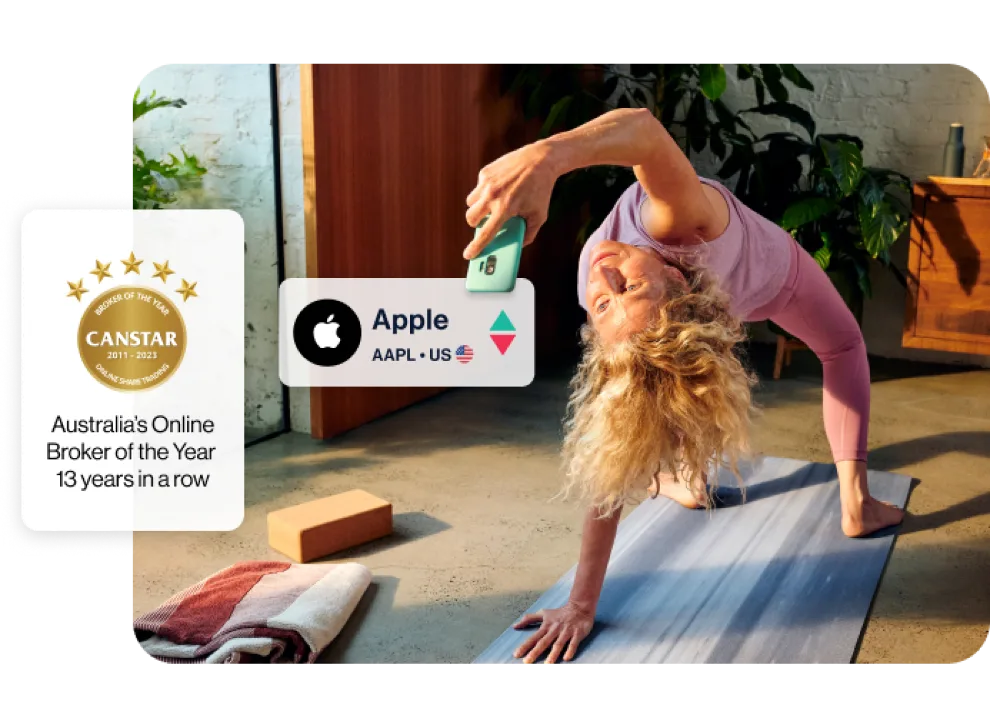 Woman doing yoga and looking at her phone, a caption shows she's looking at Apple shares