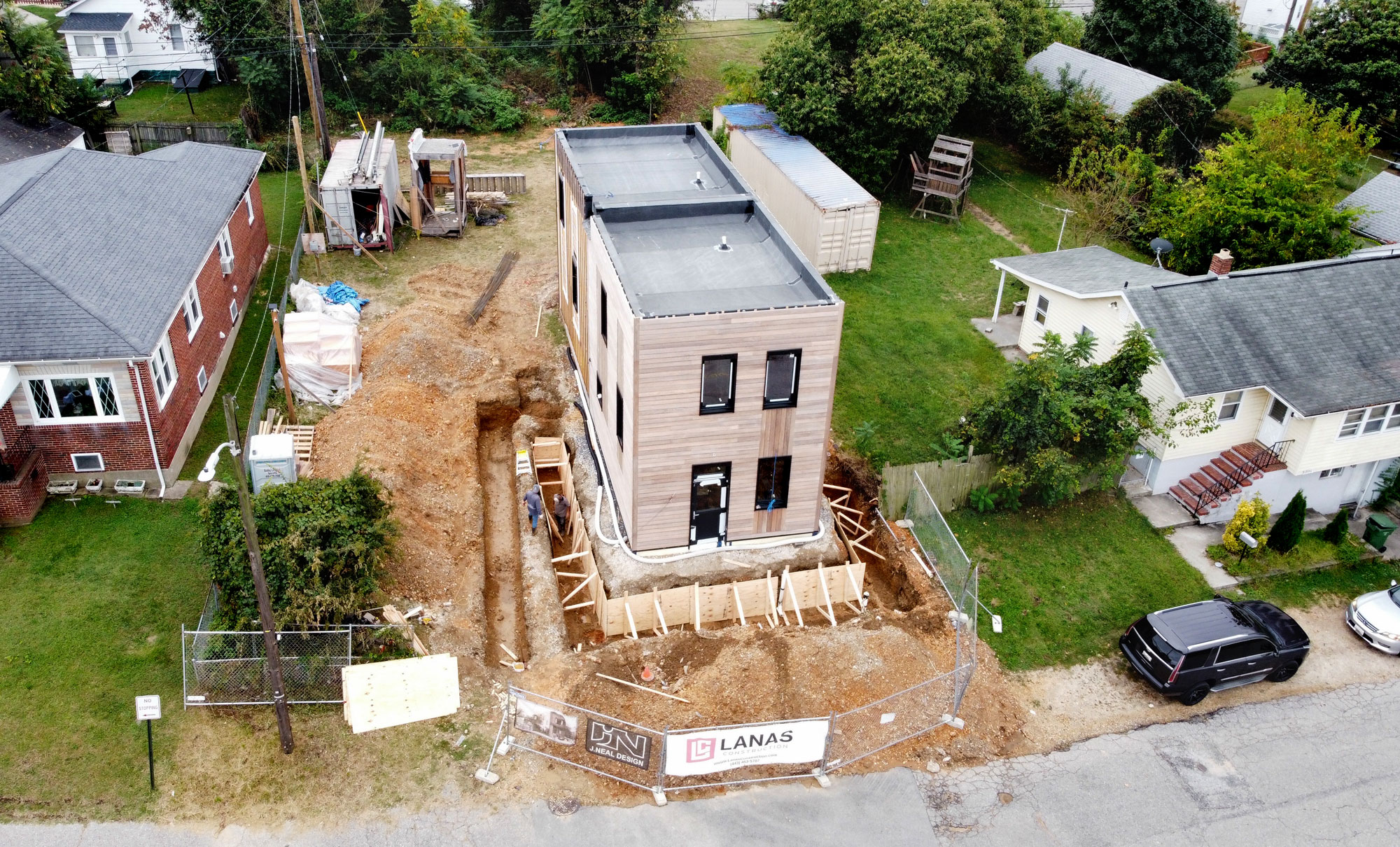 Aerial view of passive house. Its striking form stands out against the neighboring homes. Photo courtesy of Jason Neal.