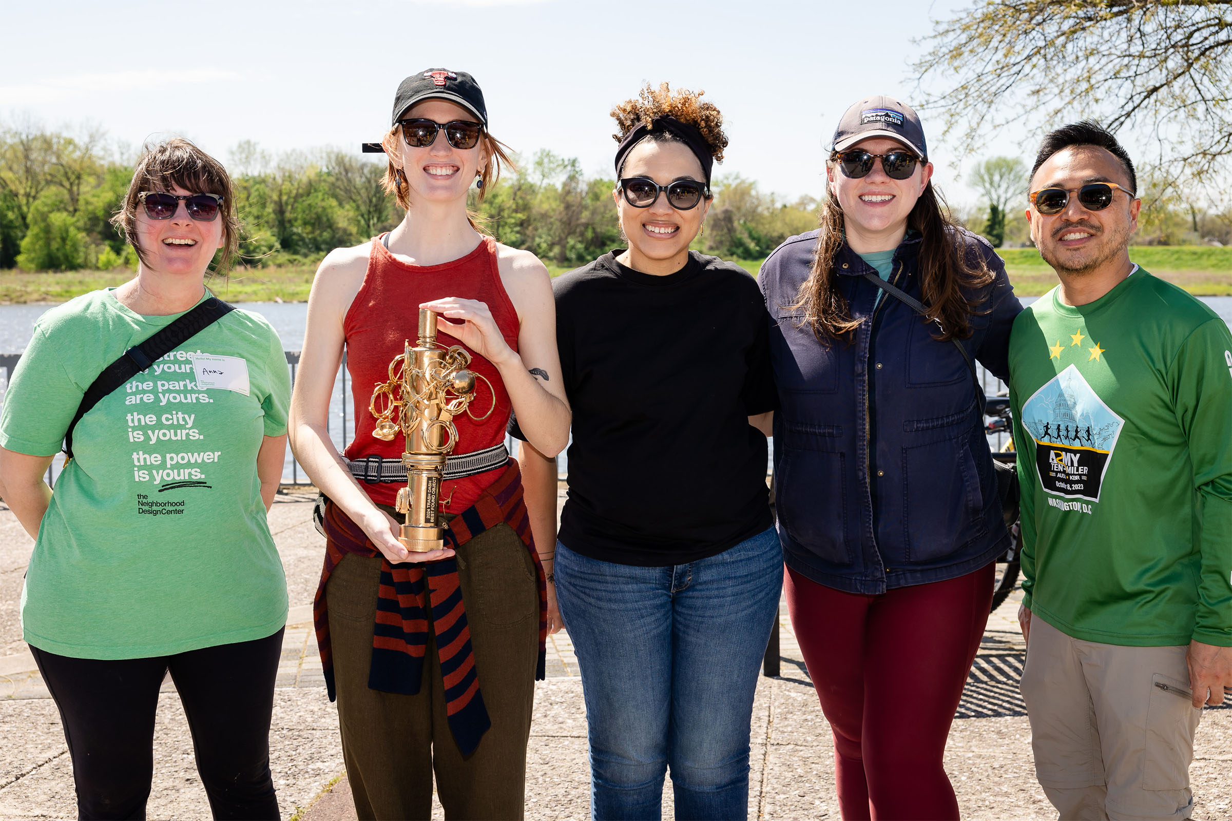 Board members engaged at trash cleanup event.