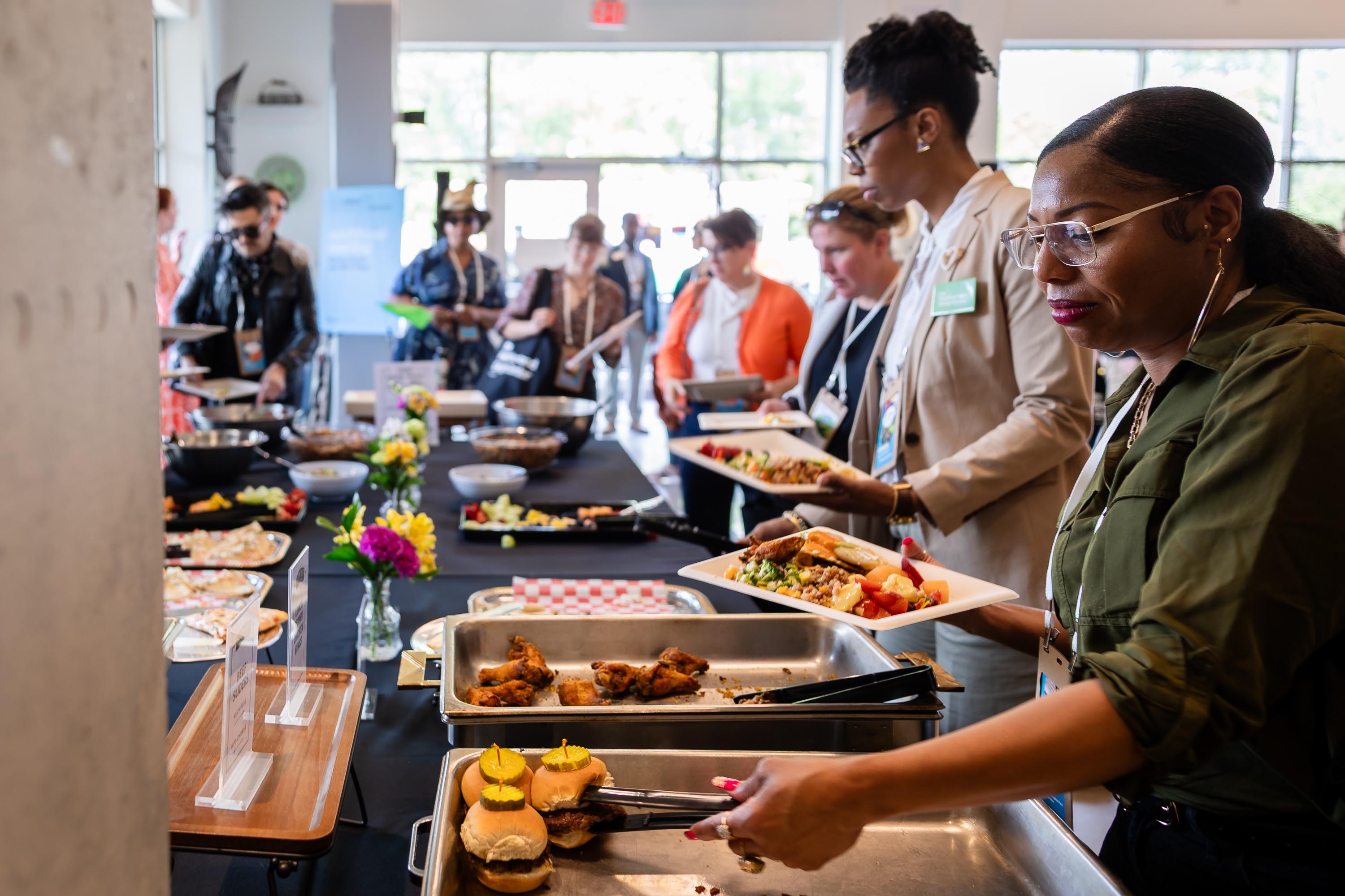 The Vision is Yours Placemaking and Placekeeping Conference 2026 participants enjoying gourmet food.