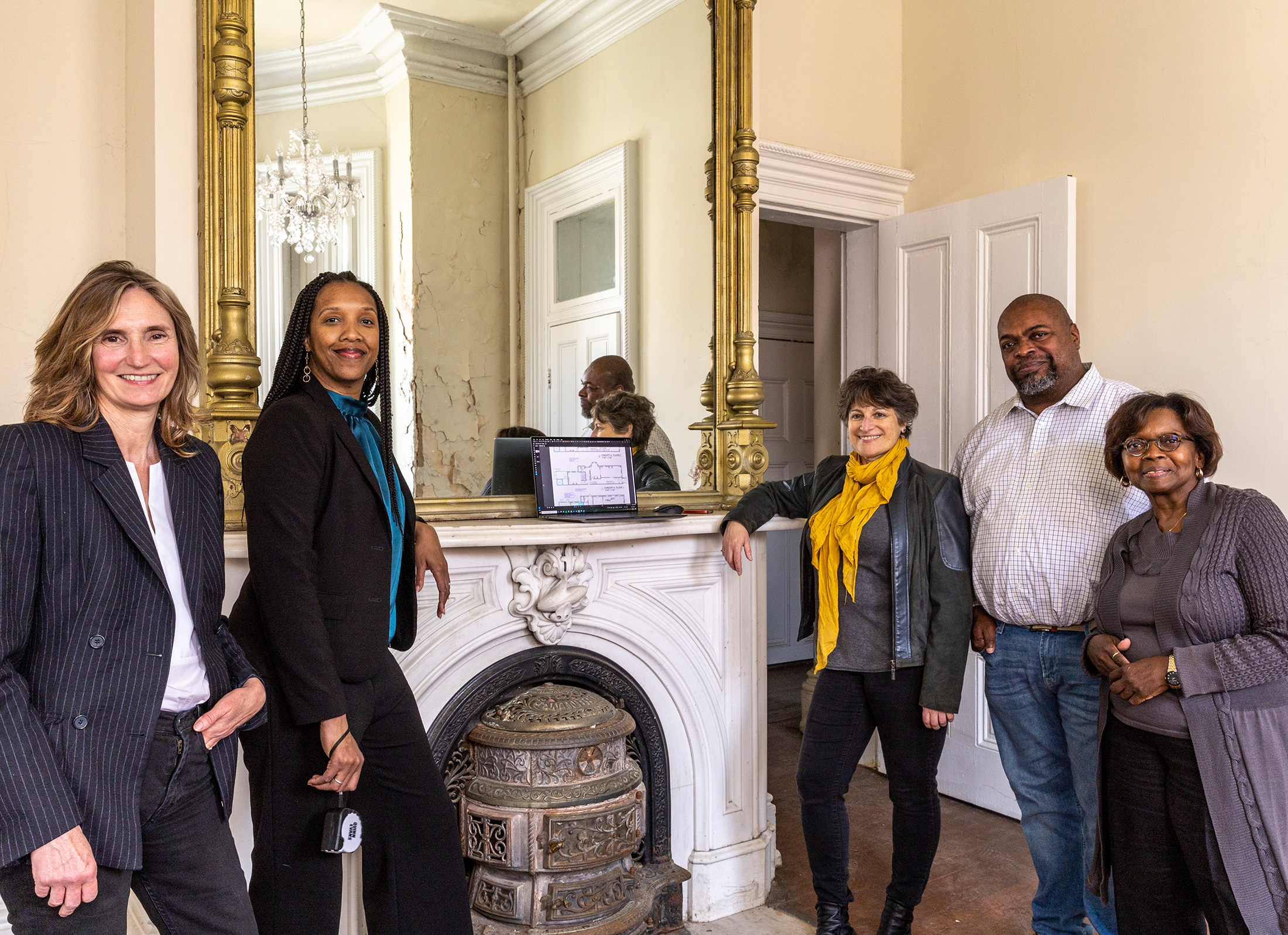 Key members the historic Parren Mitchell House restoration team (from left to right): Jennifer Goold, Neighborhood Design Center. Nakita Reed and Anath Ranon, Quinn Evans. Kelly Little and Wanda Best, Upton Planning Committee. Photos by David Whitcomb. 