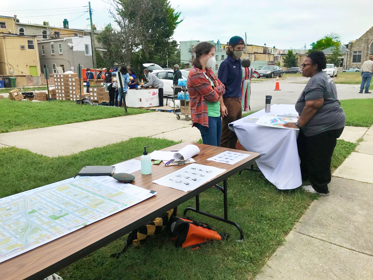 NDC Program Coordinator Laura Robinson speaking with community partners from Knox Presbyterian Church and Blue Water Baltimore in East Baltimore.