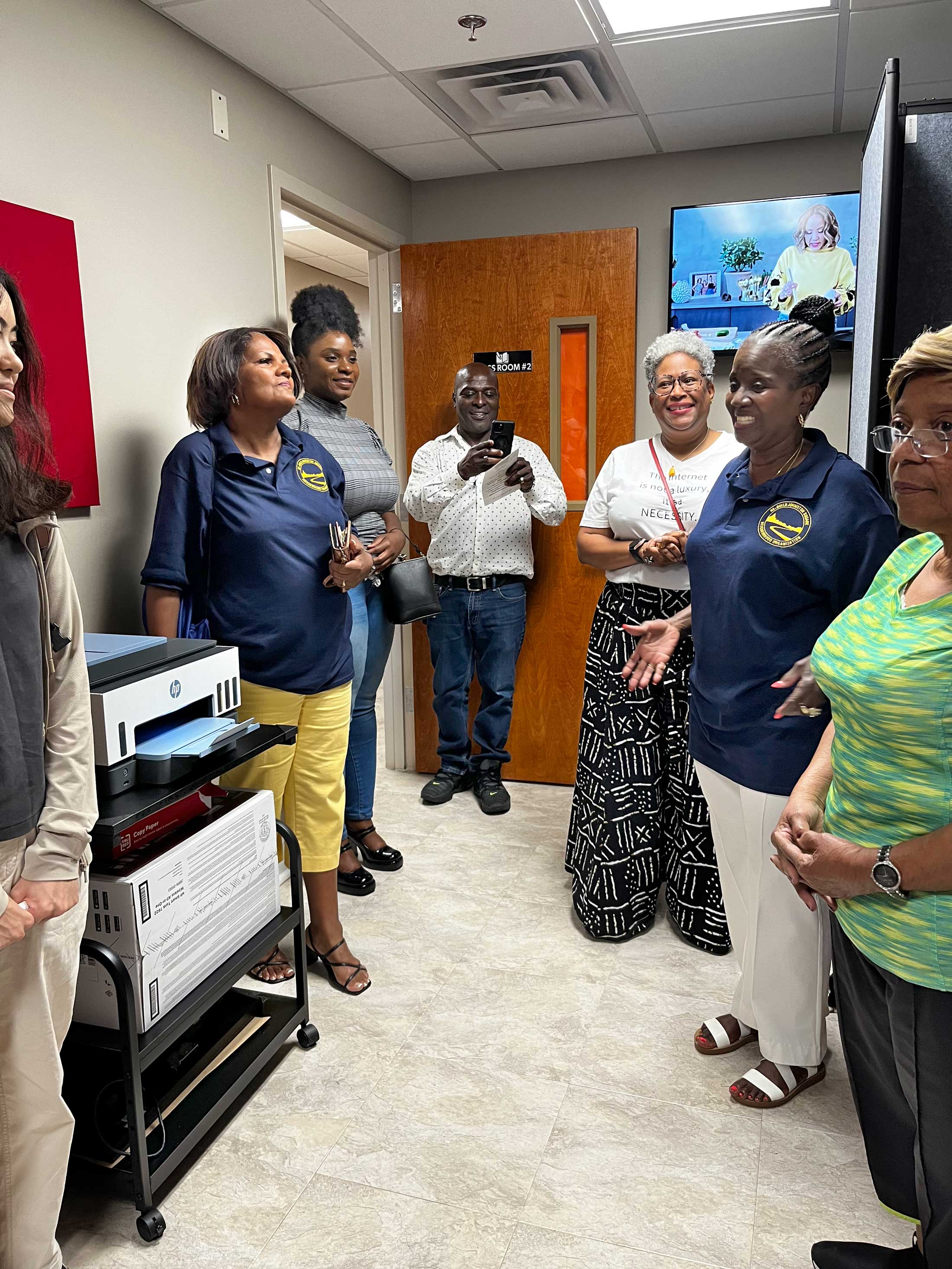 Happy community members at unveiling of Johnston Square Equity Hub.