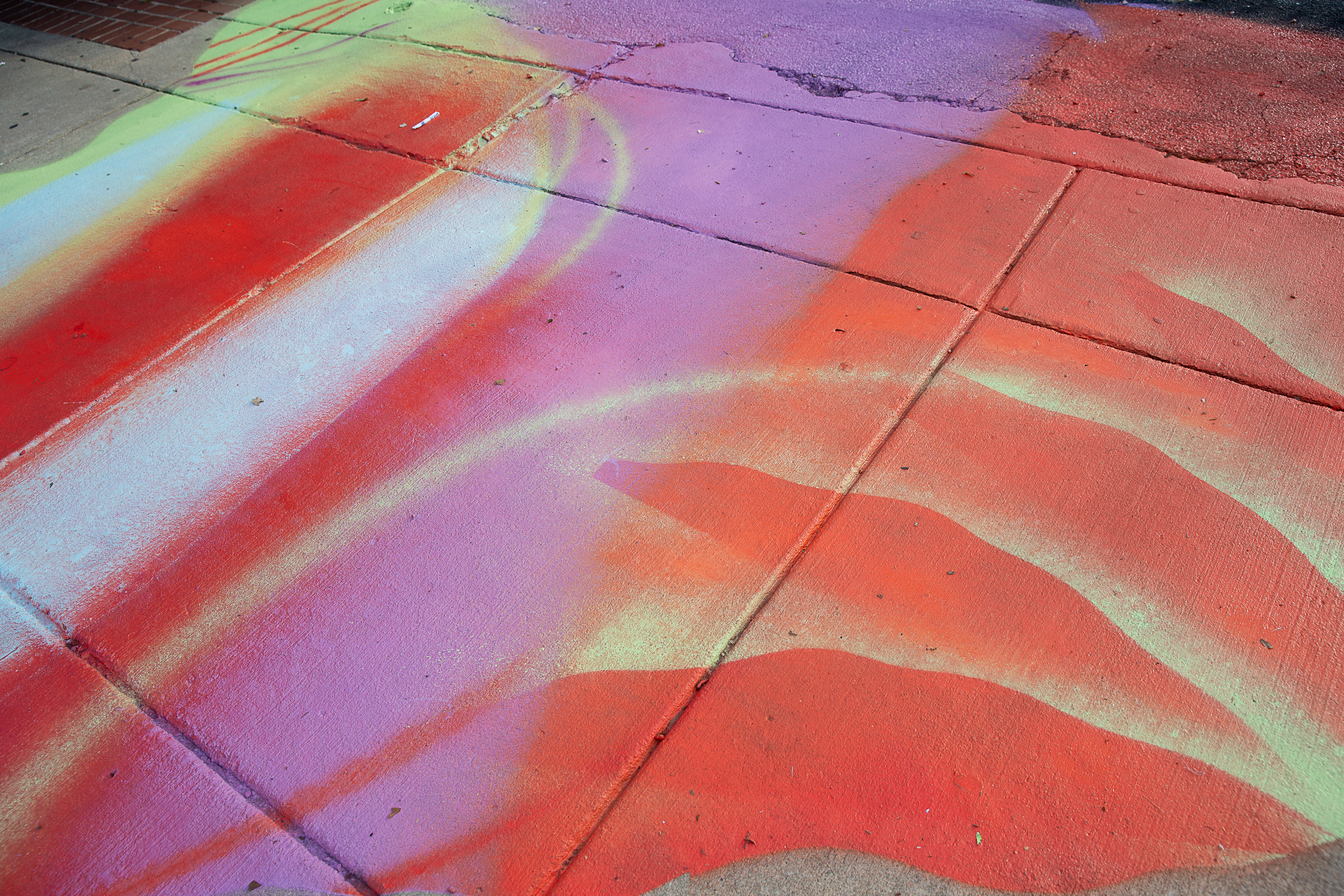 A pool of color created by Whitney Frazier and volunteers on the sidewalk.
