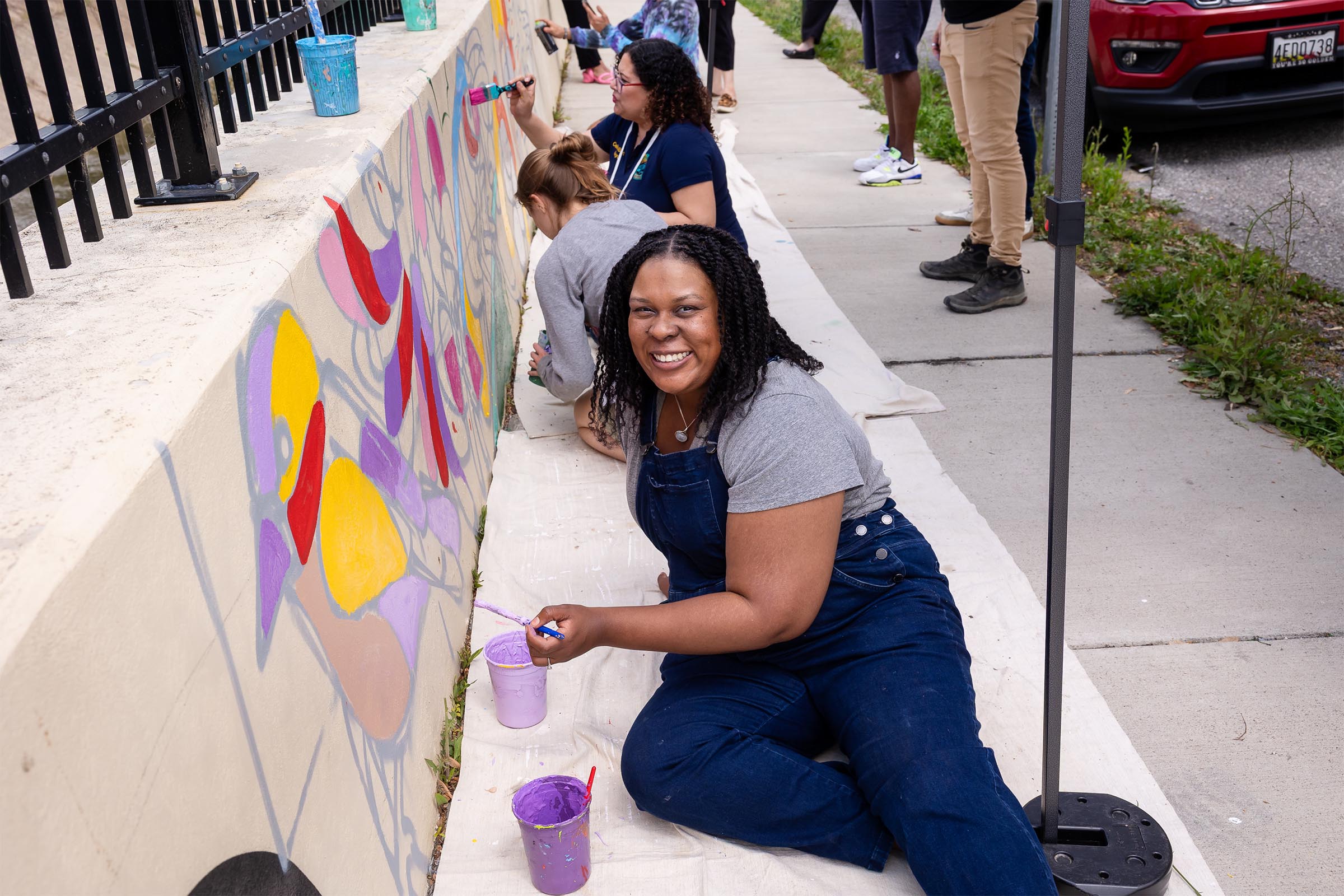The Vision is Yours 2026 participants paint a mural. Photos by Side A Photography. 