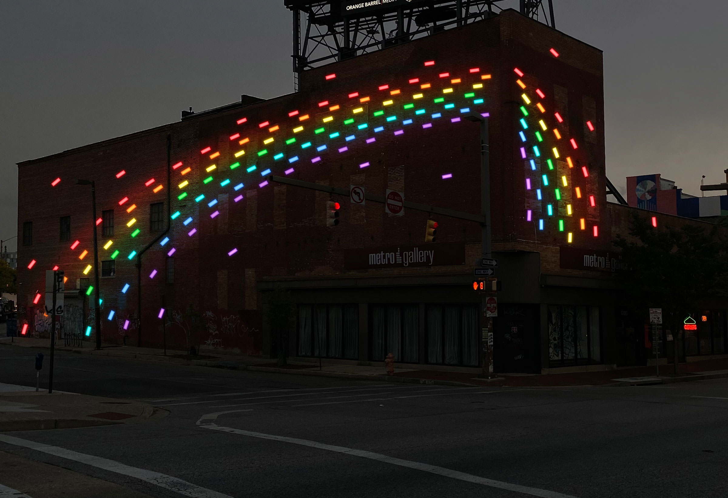 PROJECT: MODULAR LIGHT FIXTURES (FLUX STUDIO) Infinitely adaptable and scalable, Modular Light Fixtures, developed by Flux Studio, picks up on the District’s language of street art to add subtle, creative surface lighting to non-historic facades. It enhances perception of brightness
without increasing horizontal light levels. It's easy for building owners to use, can be installed on any flat surface, and has simplified power connections.