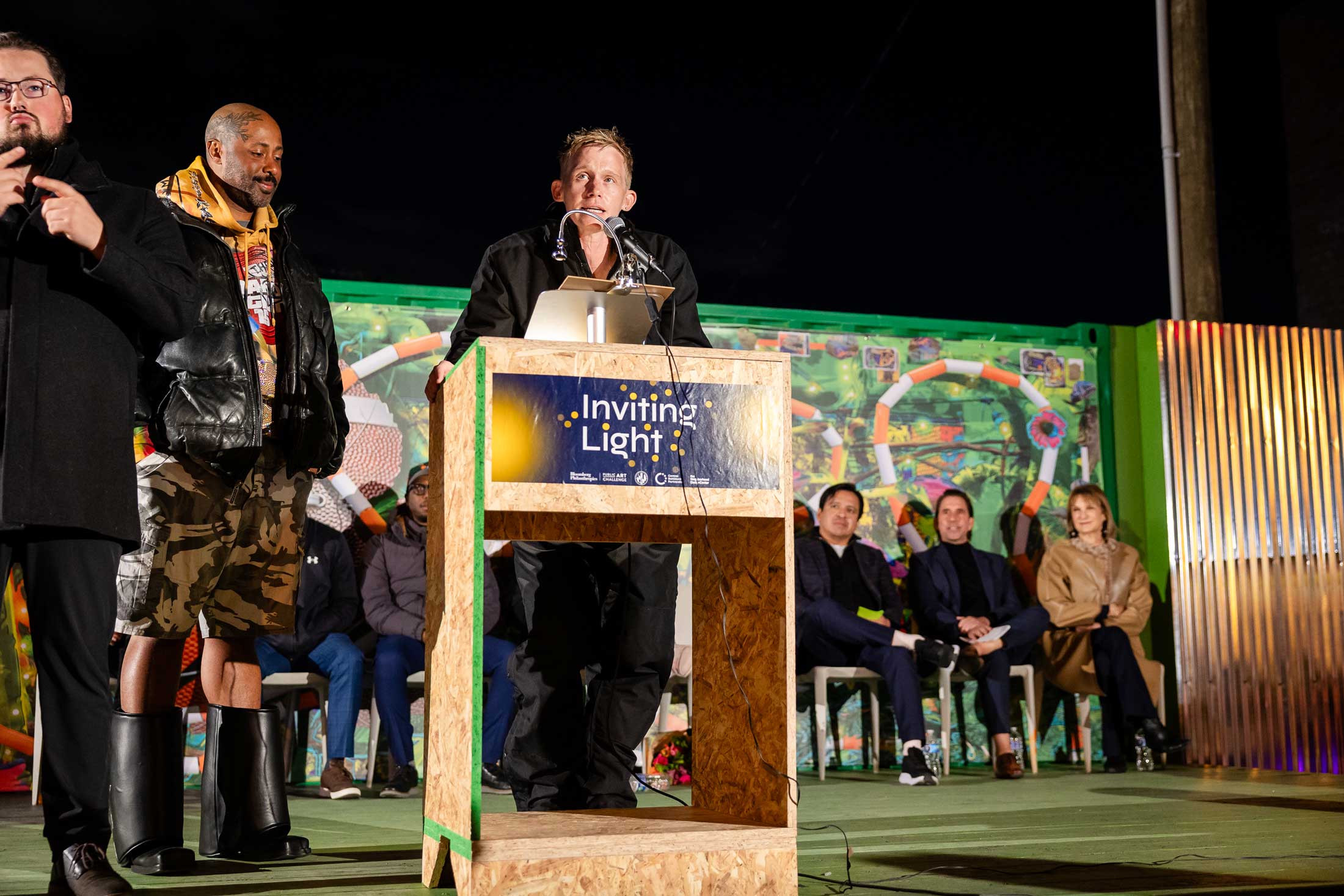 Soft Gym by Wickerham and Lomax, an Inviting Light installation at YNOT LOT in Station North Arts District. Artists Wickerham and Lomax at podium during unveiling event.