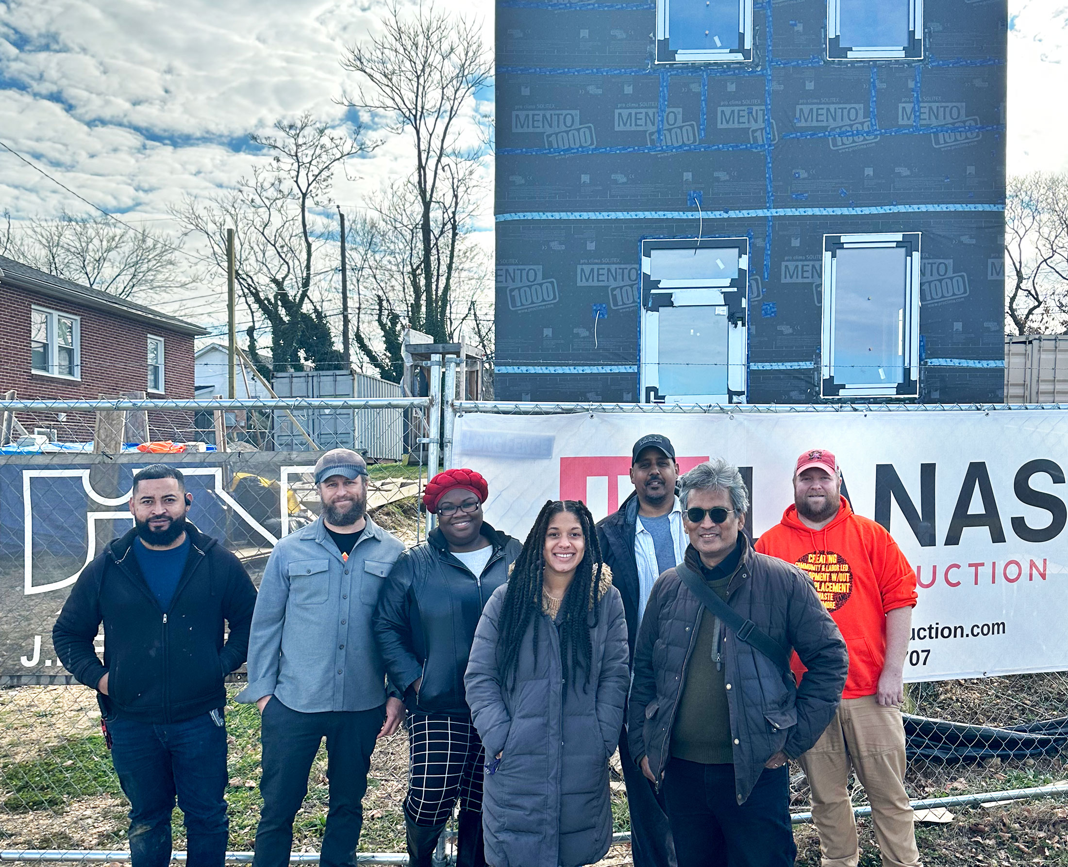 Jason, Meleny, Aziz, and other partners stand in front of underway passive home. Photo courtesy of Jason Neal.