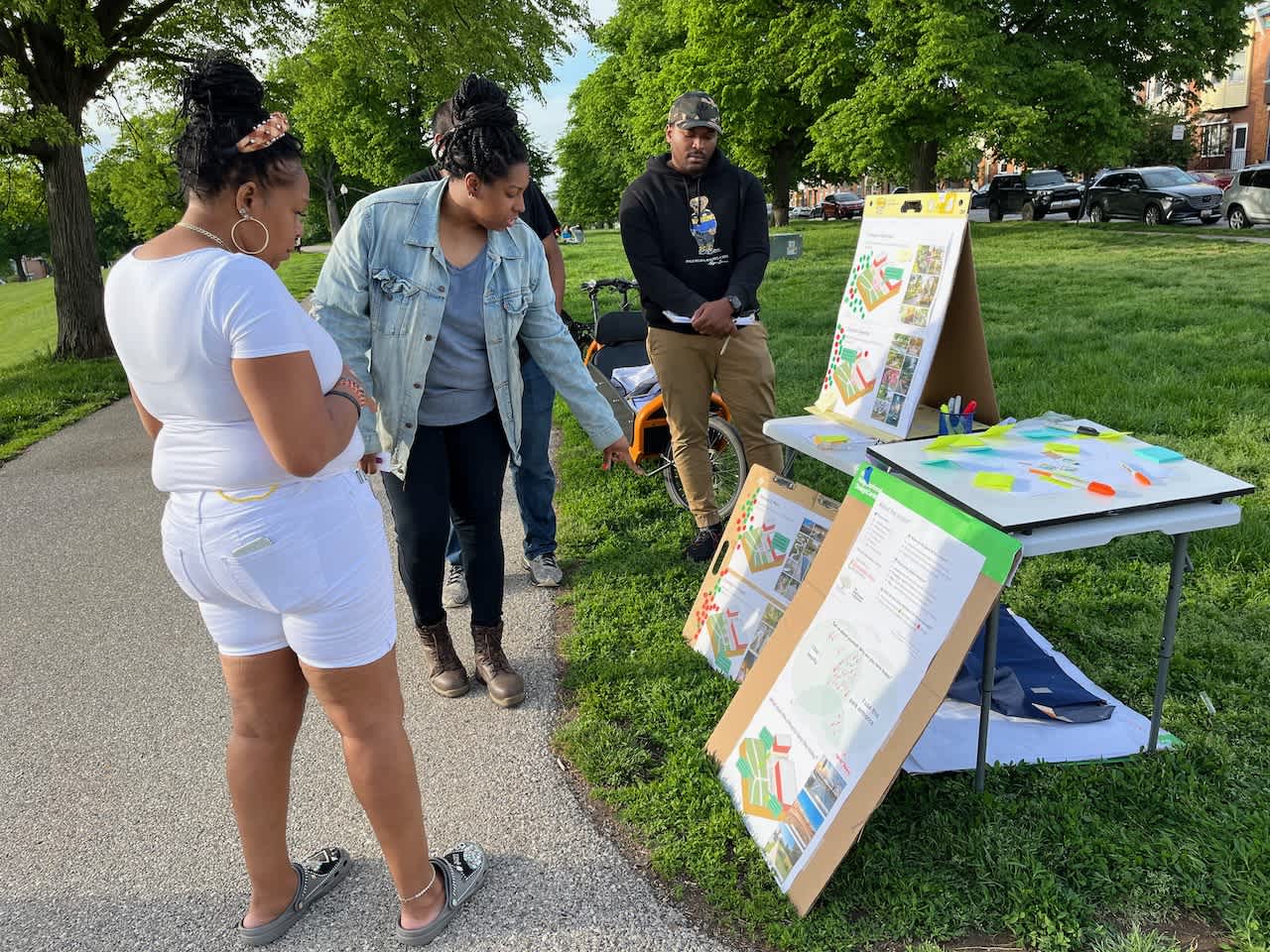 Pictured at the 3711 Patterson Park entrance: Neighbors, Destini Reavis (volunteer landscape designer, and Jalen Powell-Bartley (NDC VISTA)