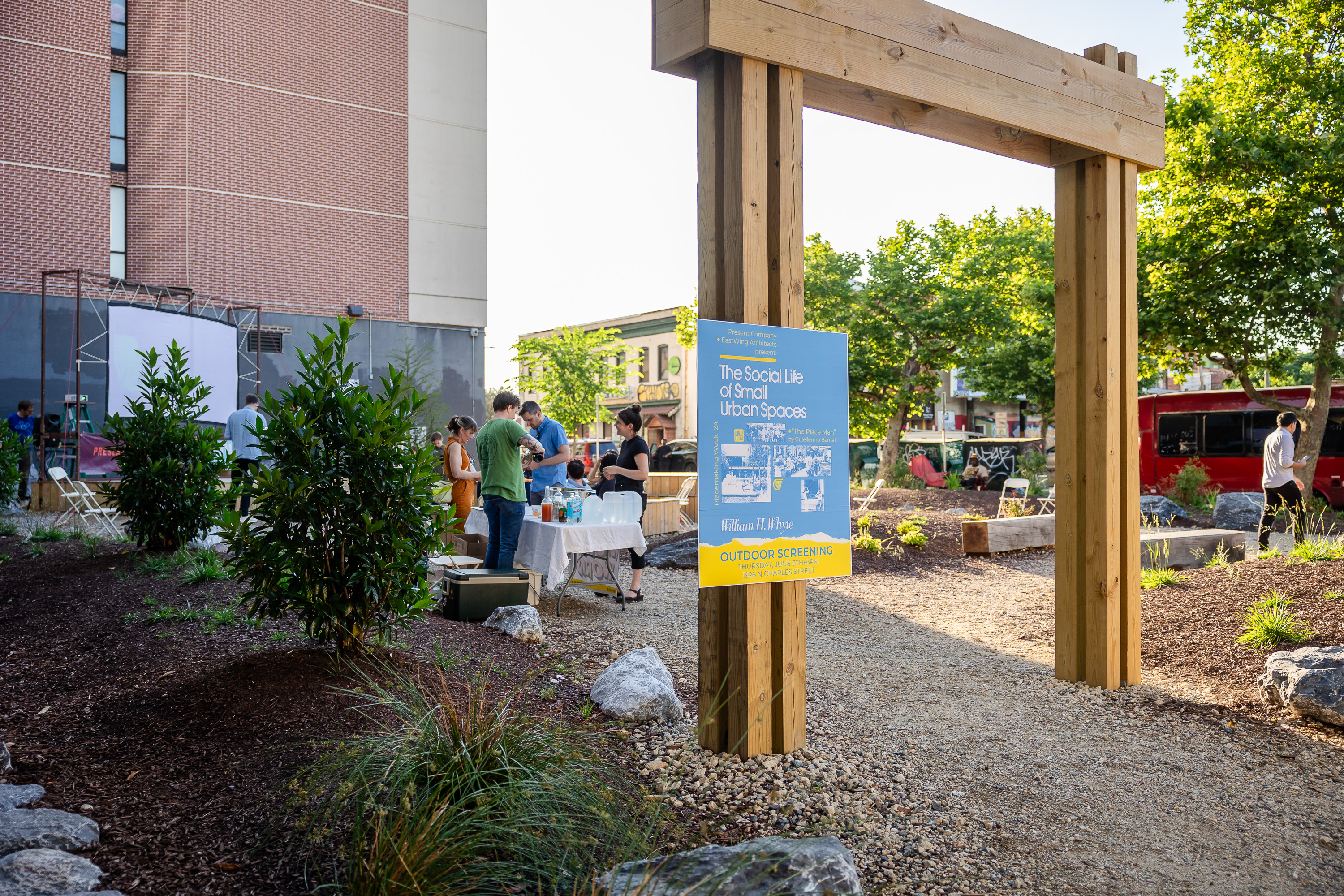Welcoming communal space with natural seating and shade.