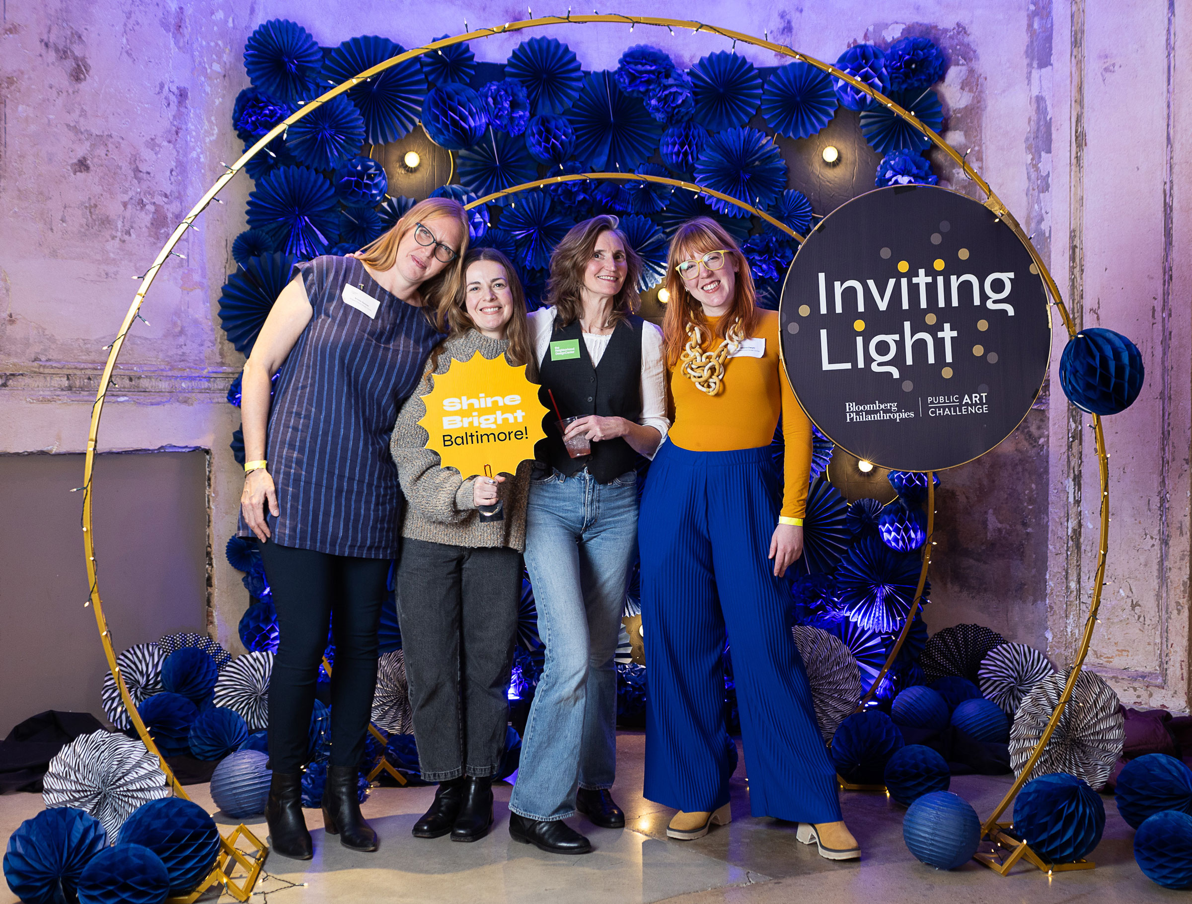 The Neighborhood Design Center Team, left to right: Deputy Director Briony Hynson, former Program Manager Merrell Hambleton (current Director of Public Engagement at the BMA), Executive Director Jen Goold, and Maura Dwyer Community Engagement Coordinator. Merrell and Maura led NDC’s Signal Station North two years prior, which gathered crucial feedback and research on the impact of lighting in the area, which ultimately informed Inviting Light. 