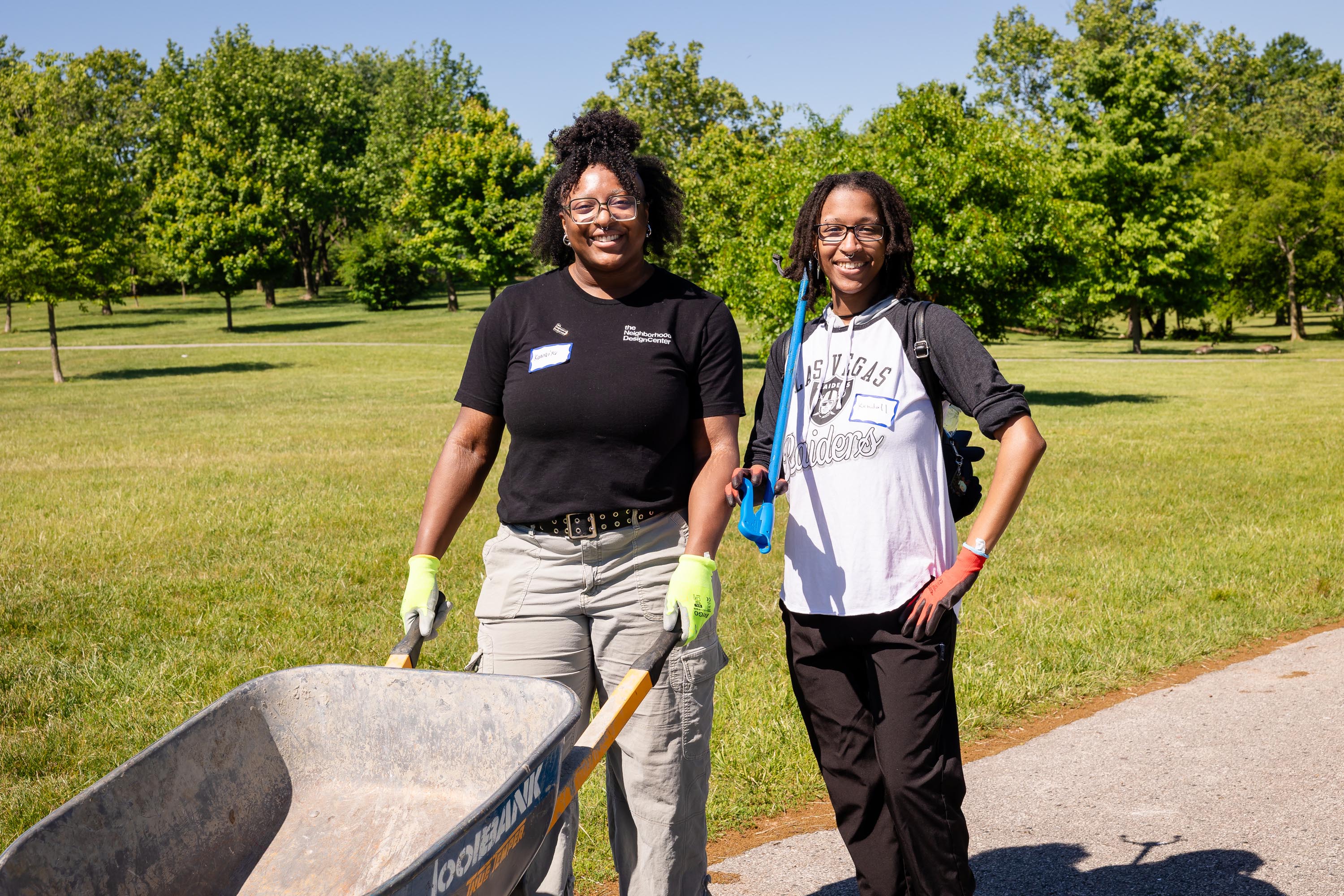 NDC member with participant, smiling with their gear.