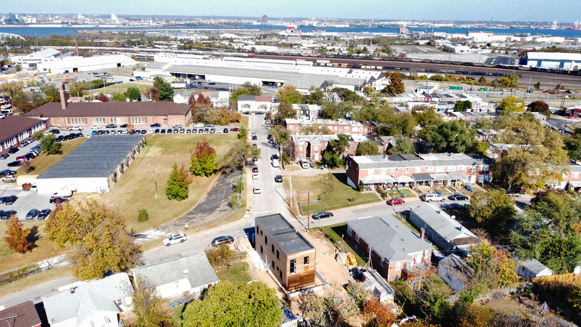 Aerial view of passive house under construction with Curtis Bay expanding in the distance. Photo courtesy of Jason Neal.