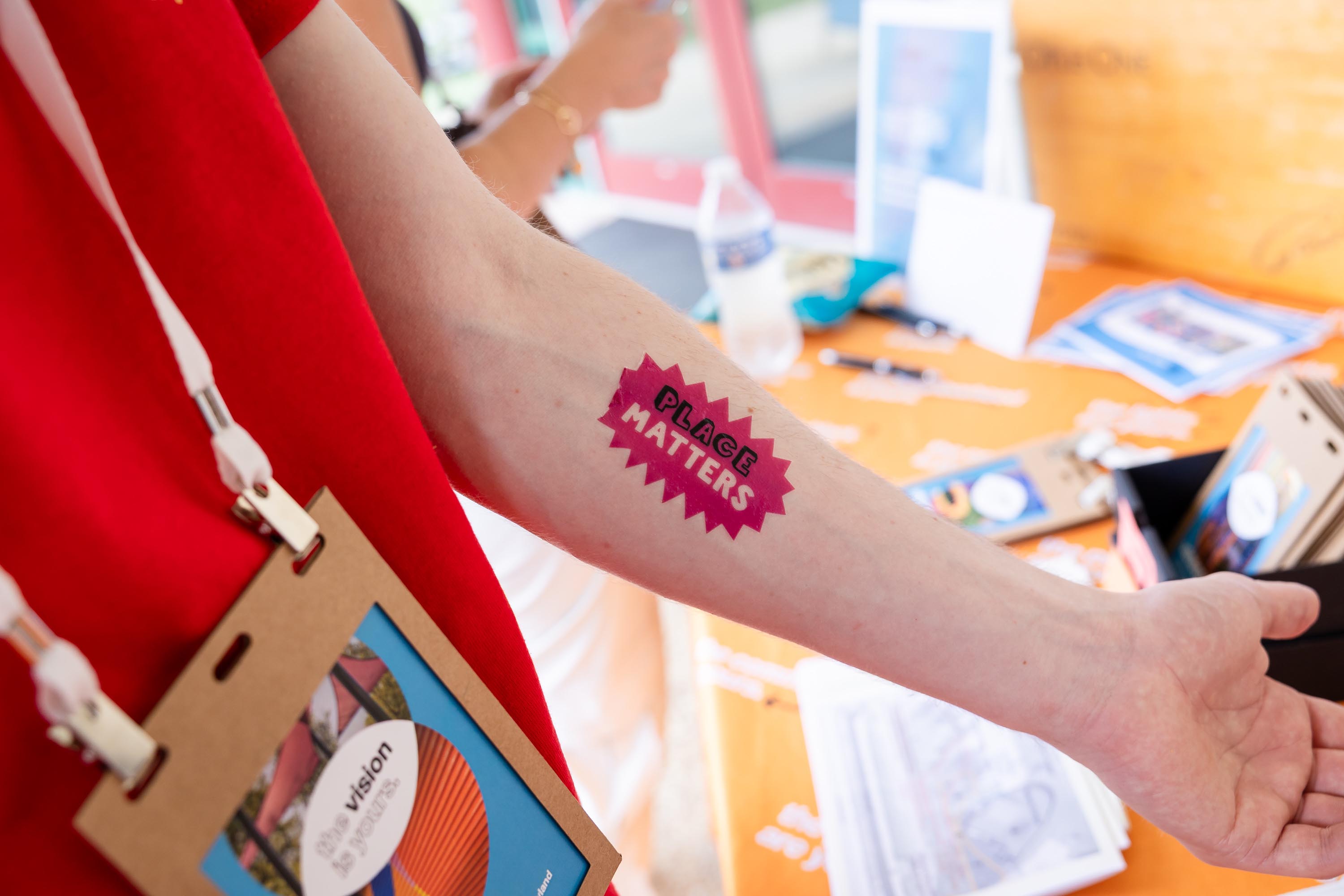 The Vision is Yours Placemaking and Placekeeping Conference 2026: temp tatoo on arm that says PLACE MATTERS
