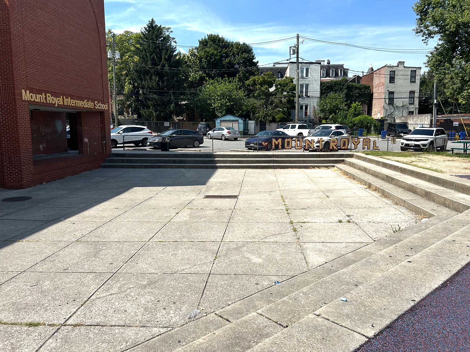 Mt. Royal Existing play space showing austere concrete amphitheater and dirt patch. 