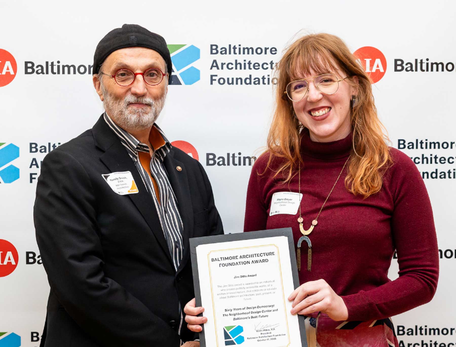 At the AIA Baltimore's annual Excellence in Design Awards ceremony, the Neighborhood Design Center won the 2025 Jim Dilts Award for their work on “Sixty Years of Design Democracy: The Neighborhood Design Center and Baltimore’s Built Future!” and anthology that showcases the power of place. Randy Sovich and Maura Dwyer accept accept the $1K award from Baltimore Architecture Foundation (BAF).