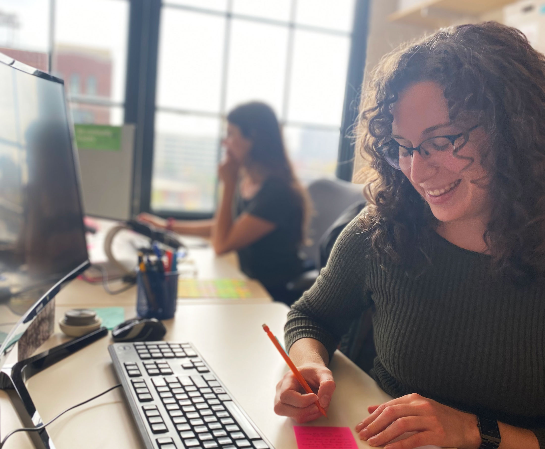 The Neighborhood Design Center's architect Karla Brent in the Baltimore Office designing arts spaces.