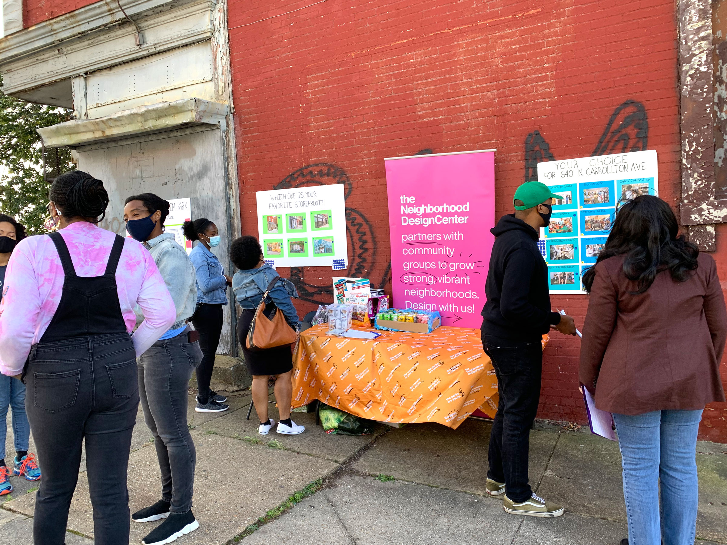 People Pictured: neighbors, Bree Jones (Parity founder) is next to the person in pink, Stephanie Paul (Volunteer architect) is behind her in the jean jacket and black pants, Derek Moore (volunteer community engagement) is in the green hat)
