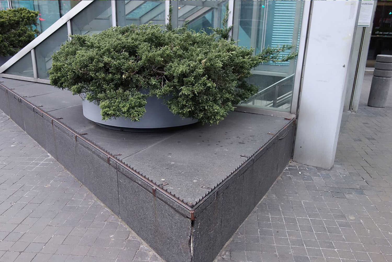 Examples of hostile architecture — spikes along this platform to prevent people from sitting. Credit: Tdorante10 Wikimedia Commons