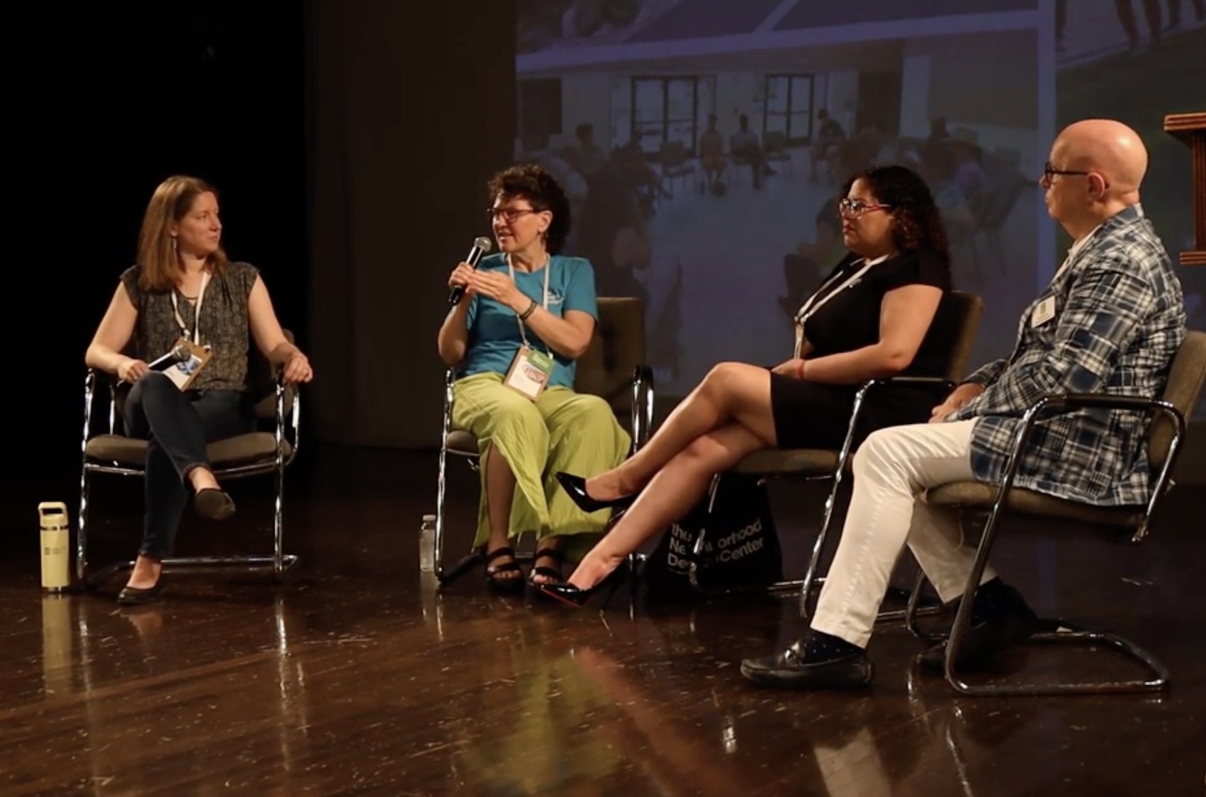 Lindsay Brugger on stage with three other panelists at The Vision is Yours conference 2026.