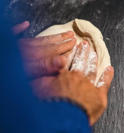 Hands kneading bread