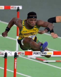 Omar McLeod hurdling in a race