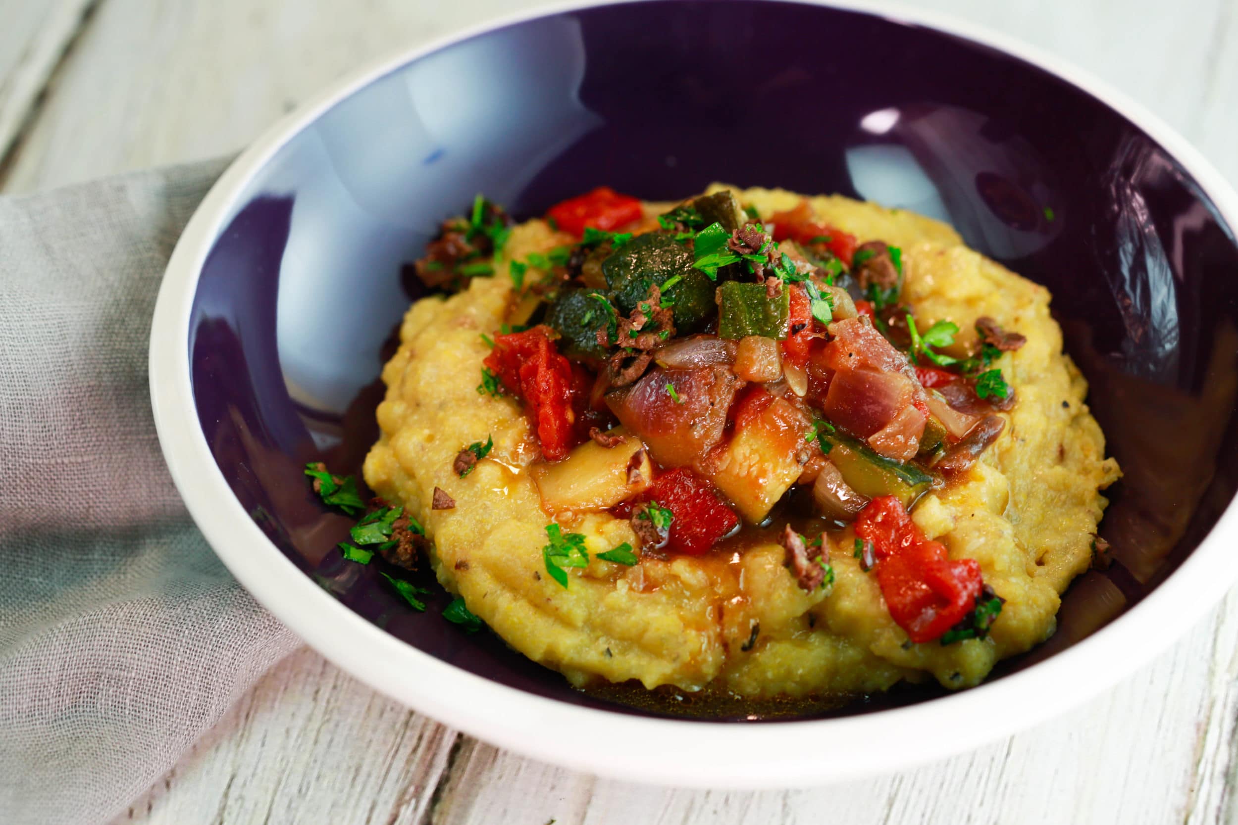 Ratatouille Olive Gremolata on Polenta with Roasted Garlic and Honey