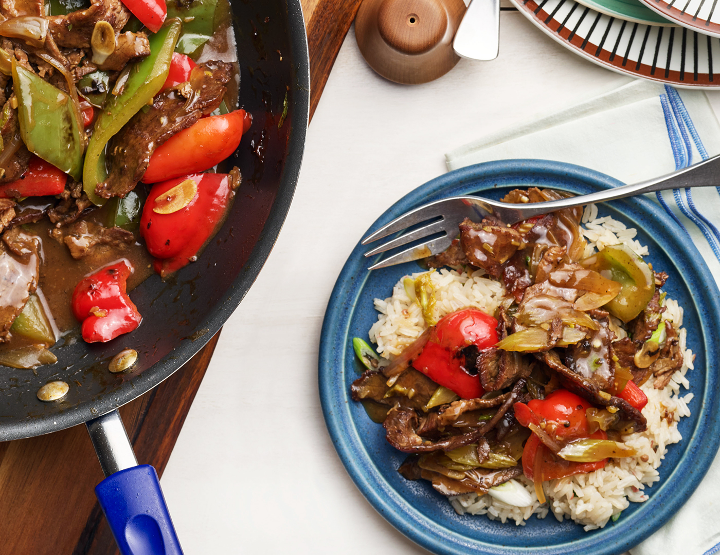 Pepper Steak Upgrade: Shaved Flank Steak with Sweet Peppers over Pink Peppercorn Rice