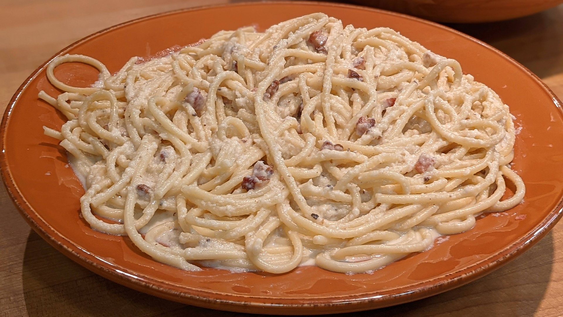 Bucatini with Creamy Bacon and Onion Sauce