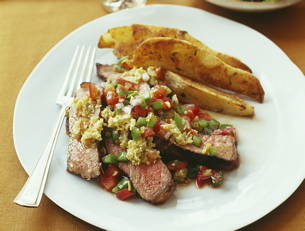 Strip Steaks with Salsa, Roasted Potato Wedges and Hearts of...