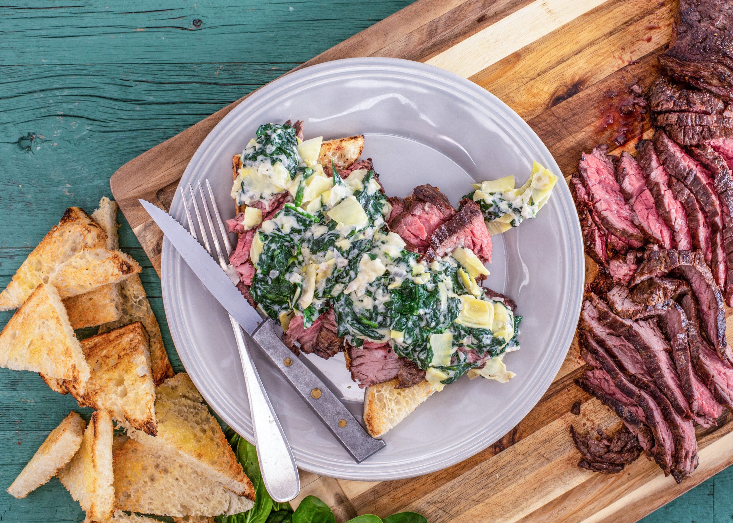 Sliced Steak with Creamed Spinach & Artichokes